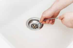Traditional methods, using drain snake to unclog kitchen sink, Hydro Jetting.