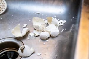 Eggshells in the sink, Clogged kitchen sink.