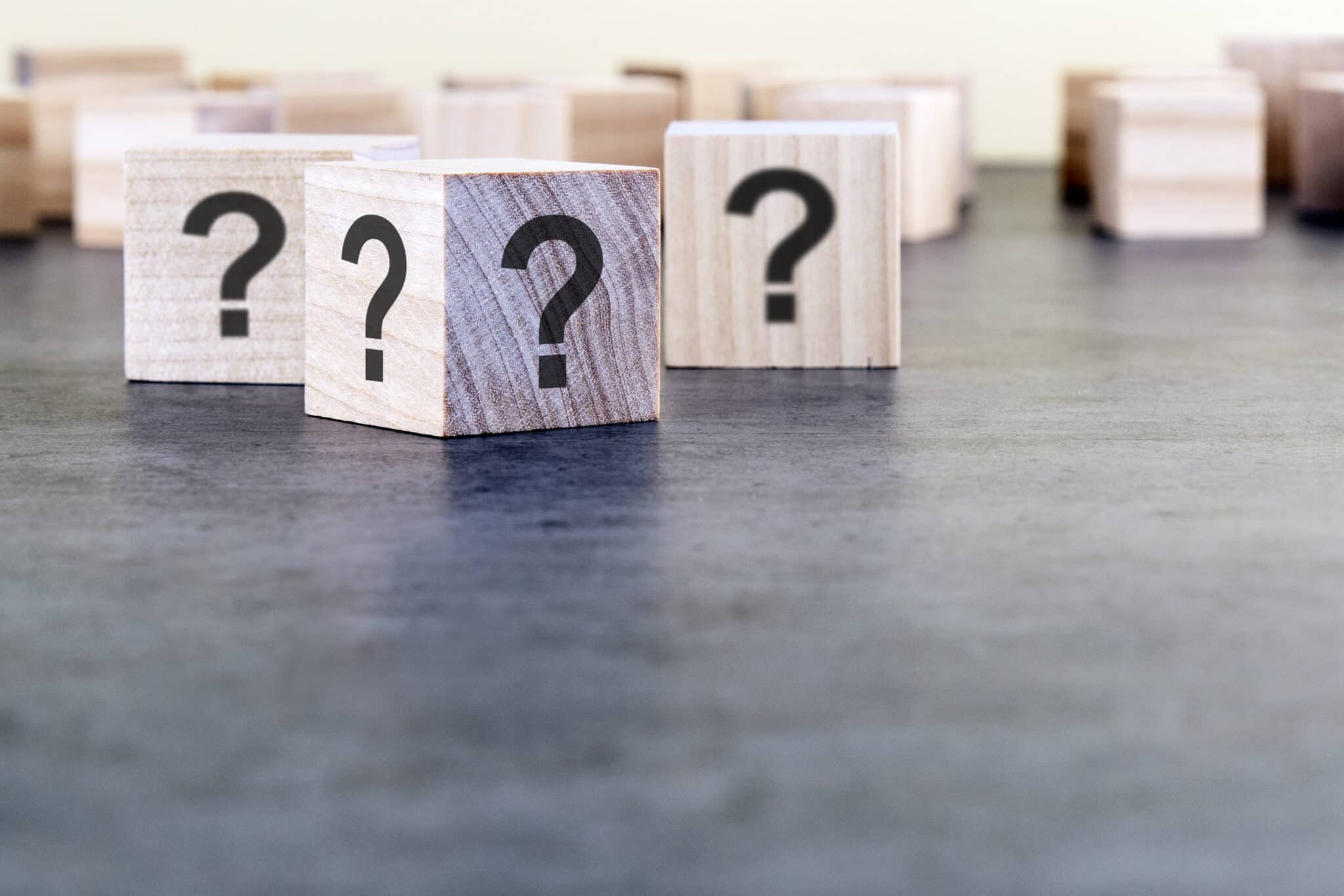 Cube with question mark on wooden background, Pressure regulator valve.