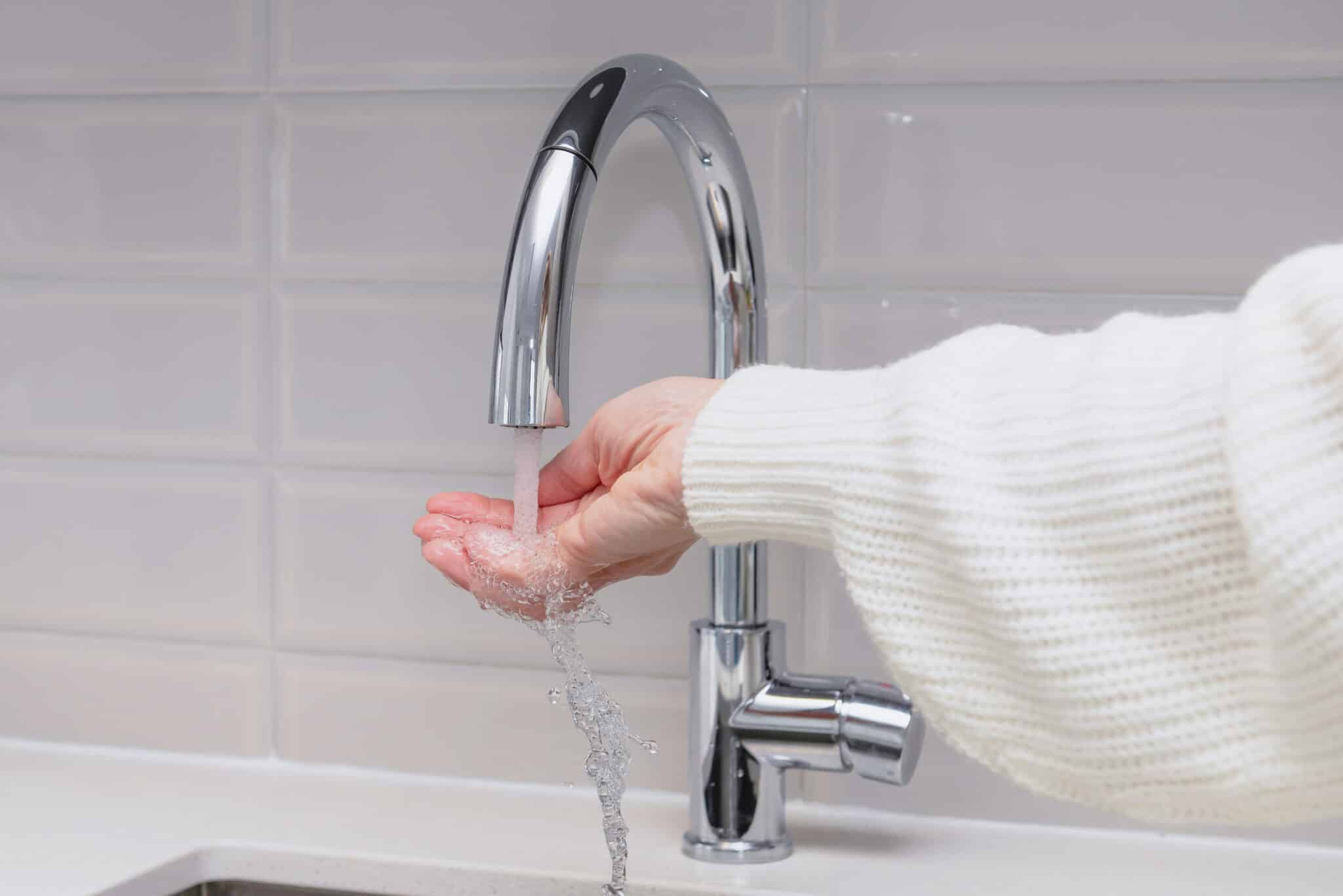 Checking the temperature of water from kitchen faucet, pex manifold setup.