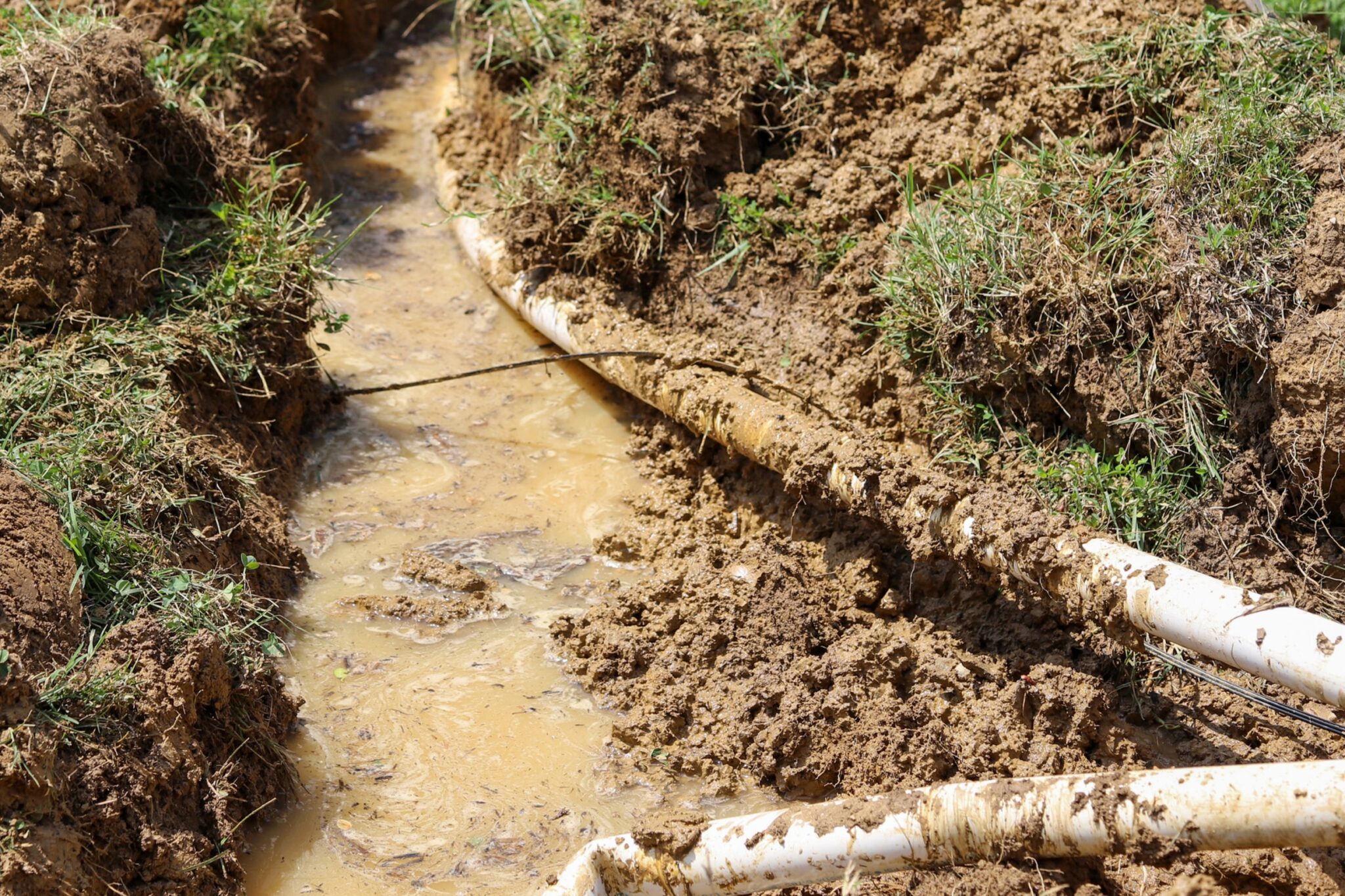 Warning signs of soil shift plumbing issues 1 Leaking underground pipe, soil shift plumbing issues.