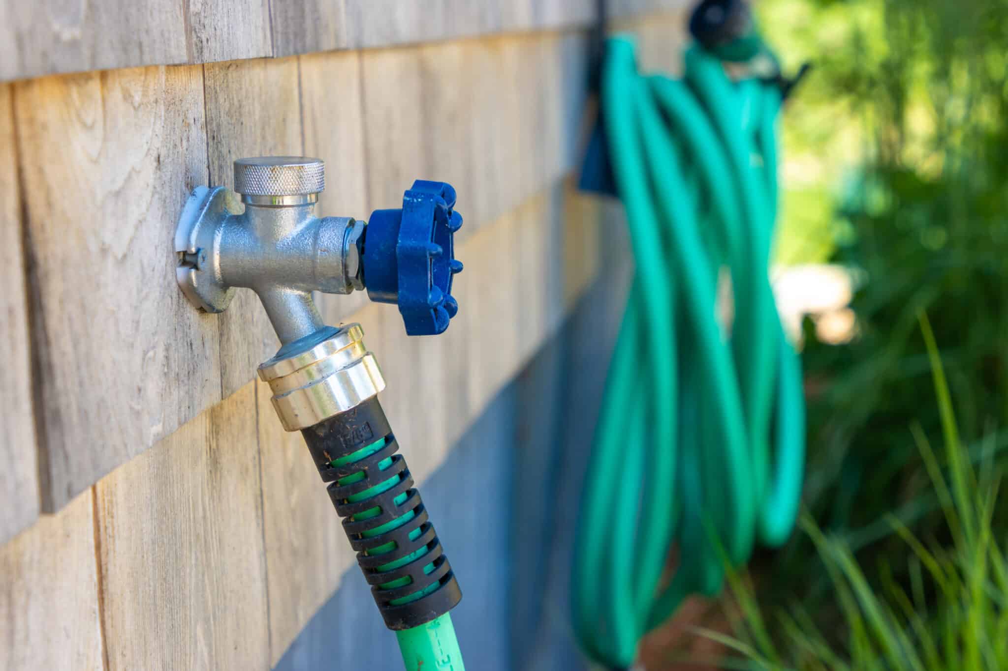 Hose bibs connected to garden hoses, cross connection hazards.