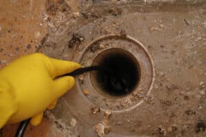 Cast iron descaling that restores smooth drain flow.