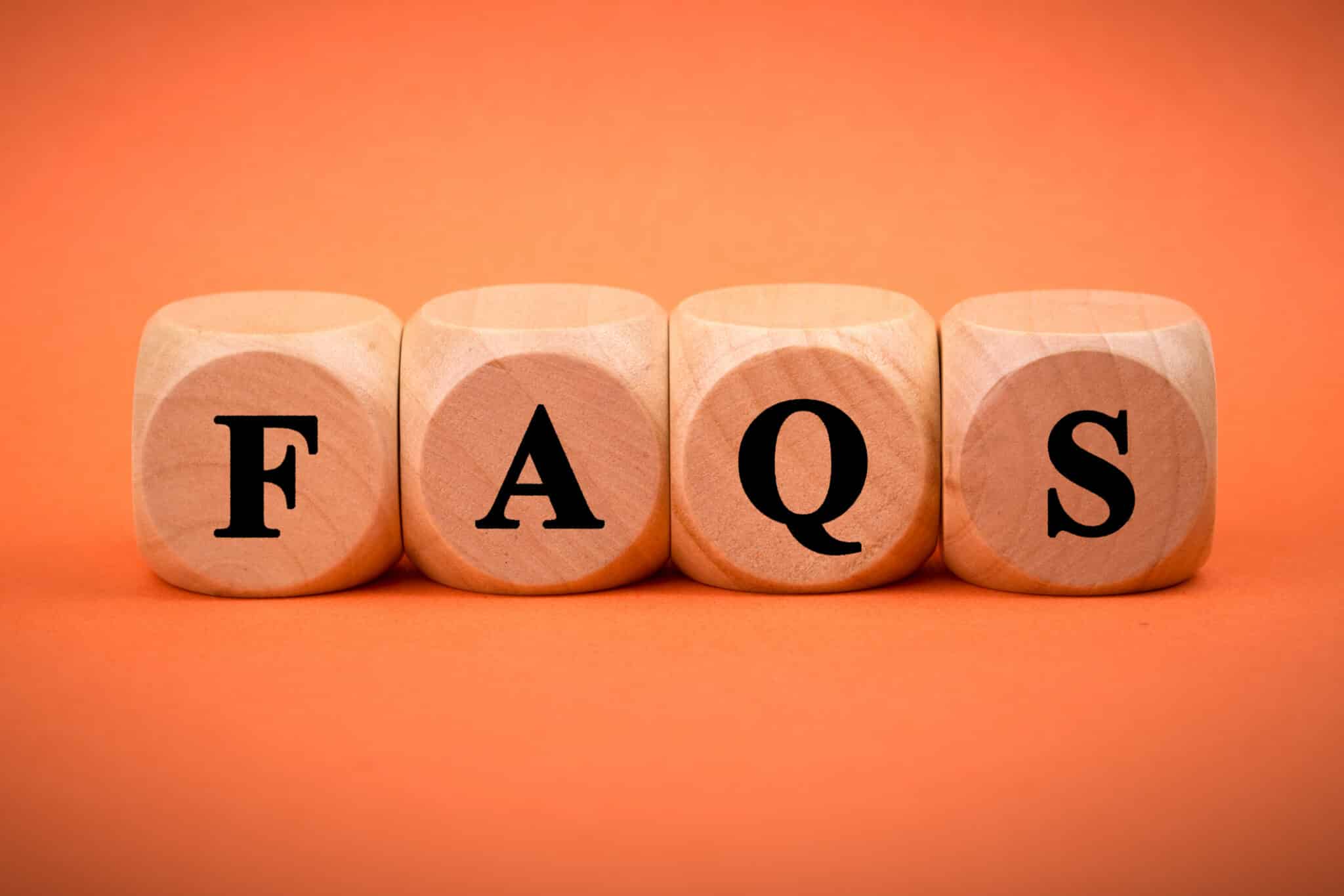 Faqs wooden blocks isolated on color background, dishwasher tailpiece upgrade.