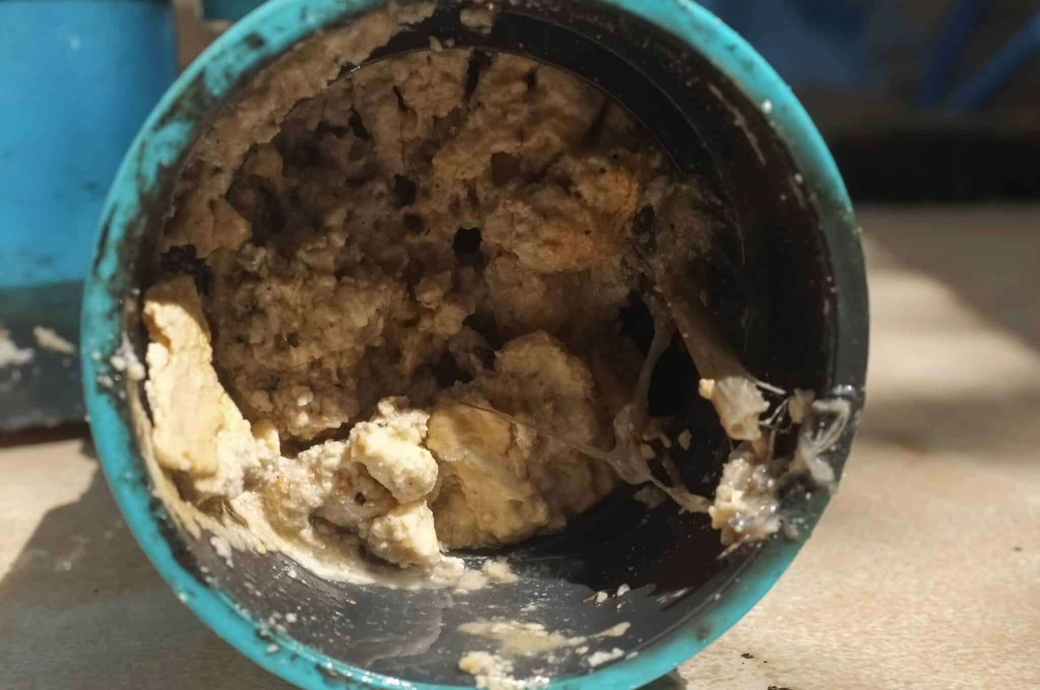 A pipe clogged with thick fats, oil and grease, hydro jetting service.